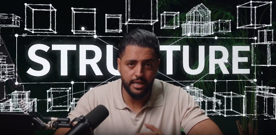 Tarik El Mazani on camera in front of a wireframe structure graphic, representing the Frame Game concept